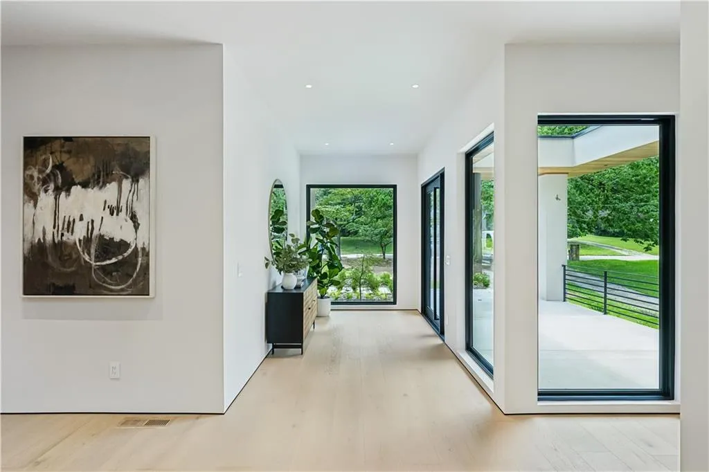 Corridor featuring wood finished floors