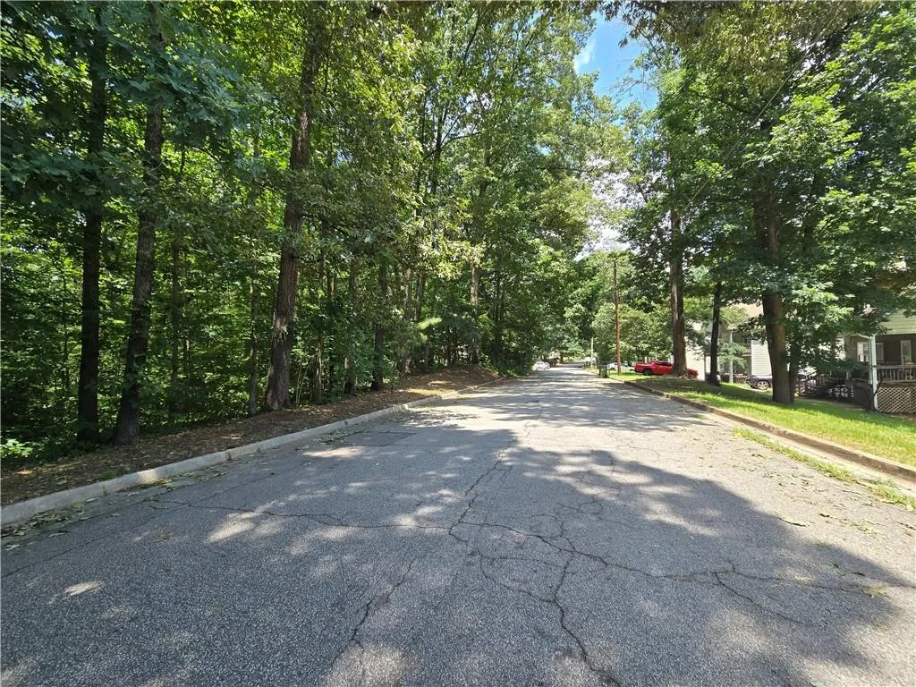 View of asphalt street with curbs