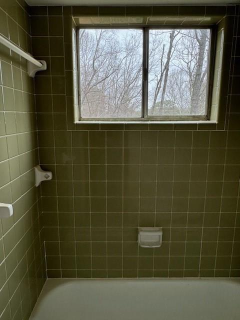 Second level bath featuring vintage tiled shower / bath