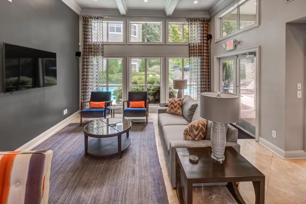Living room with ornamental molding and recessed lighting