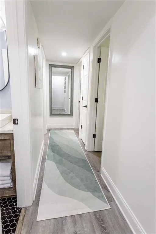 Corridor featuring light hardwood / wood-style floors