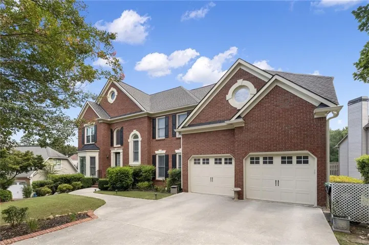 Brick exterior with multi-pane windows and decorative shutters