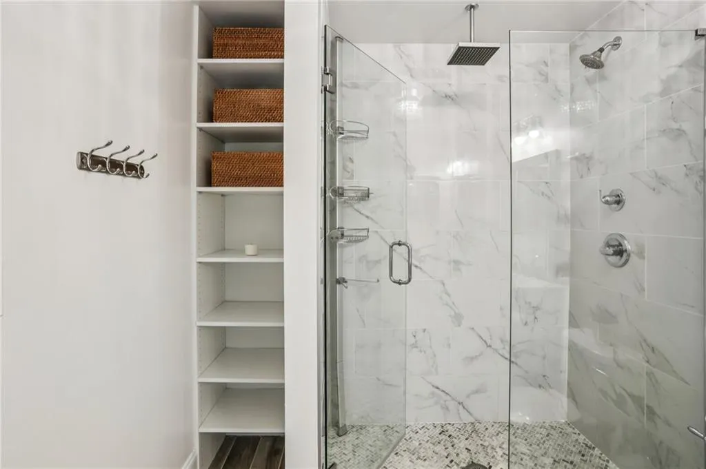 Renovated primary bathroom with built-in storage
