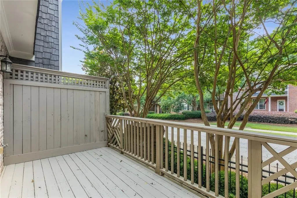 Off the living room, French doors lead to the darling back porch. Watch the world go by as you enjoy your morning coffee!
