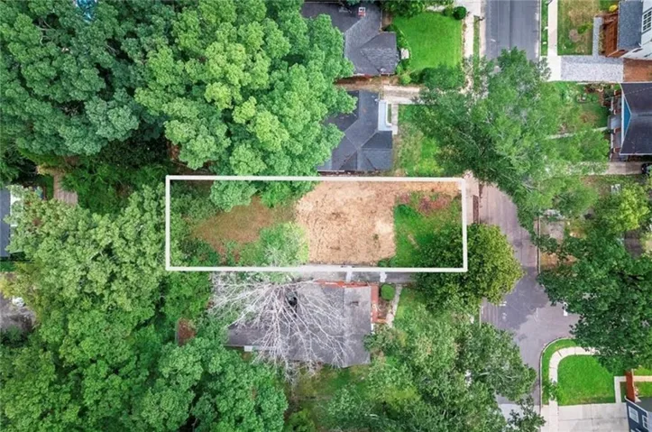 Level lot with surrounding mature trees and defined street frontage