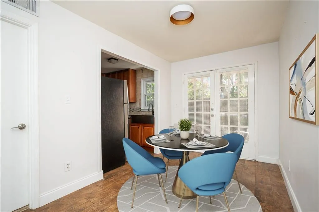 Dining space with wood finished floors and baseboards
