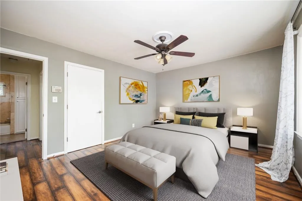 Bedroom featuring wood finished floors and ceiling fan
