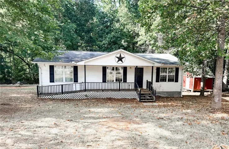 White siding exterior with black shutters