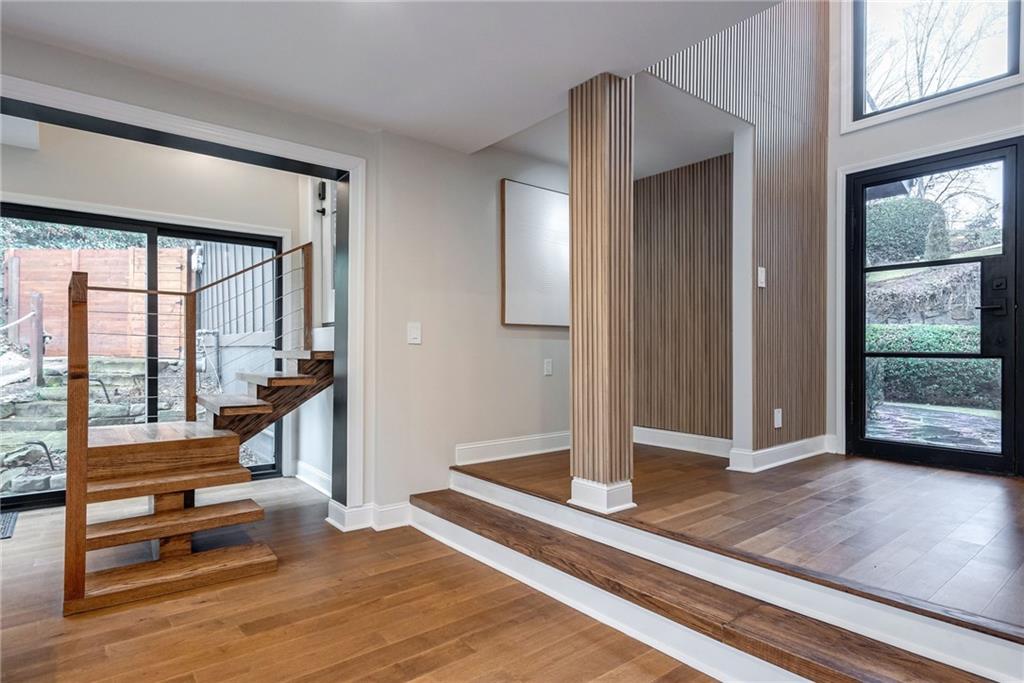 Foyer entrance featuring dark hardwood / wood-style floors