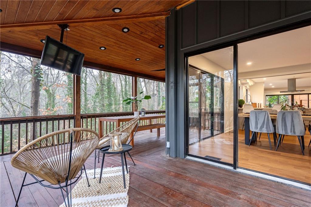 Sunroom with wood ceiling and vaulted ceiling