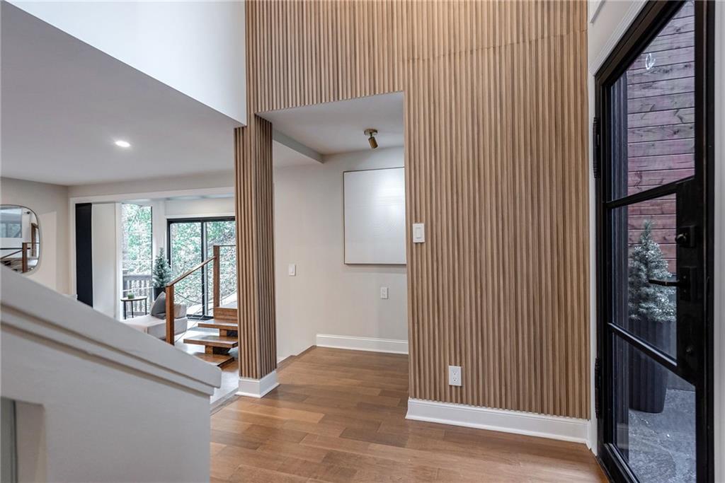 Foyer entrance featuring hardwood / wood-style floors