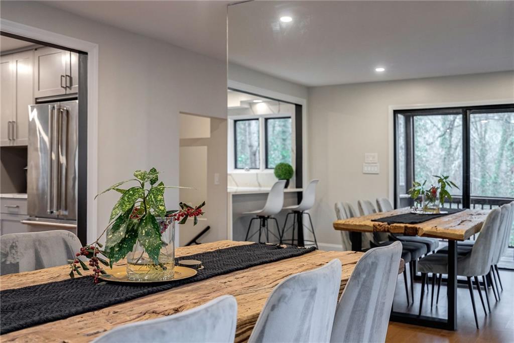 Dining area with wood-type flooring