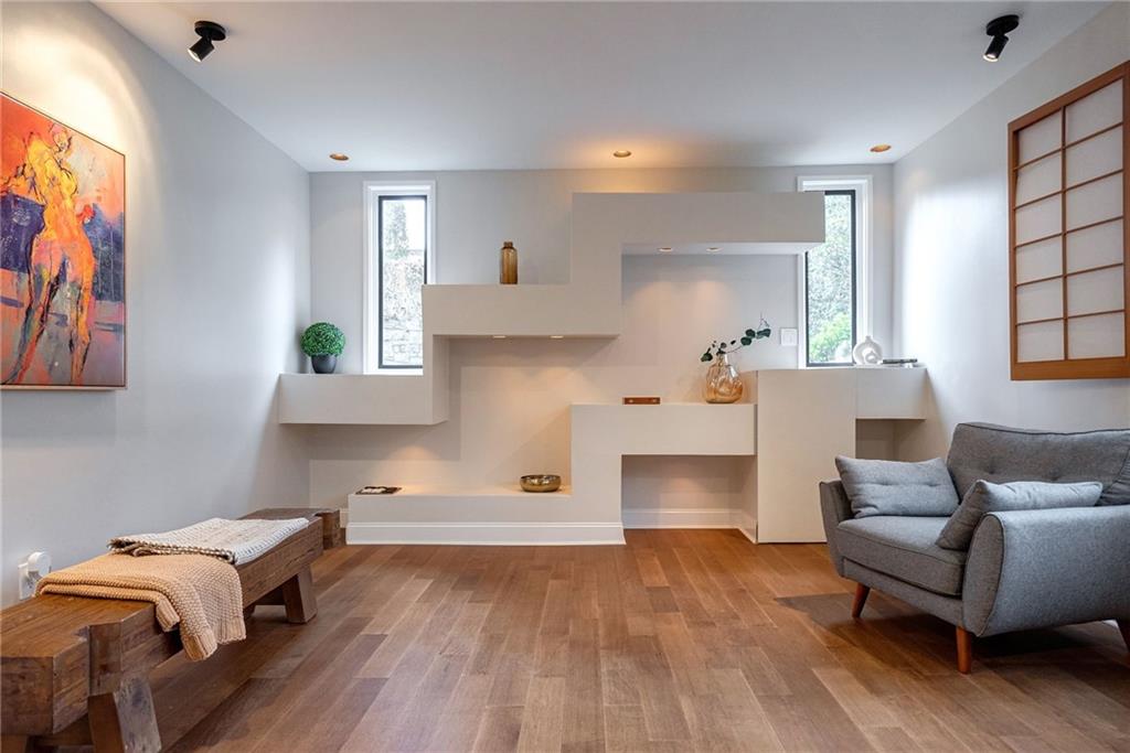 Living area with light hardwood / wood-style floors