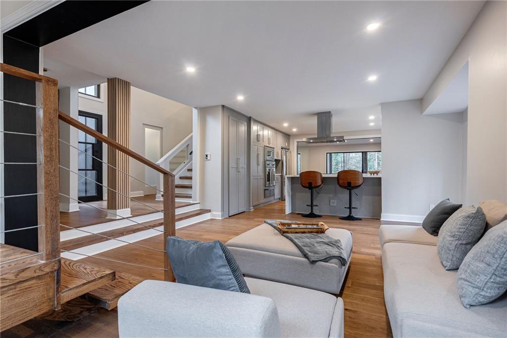 Living room with light hardwood / wood-style flooring