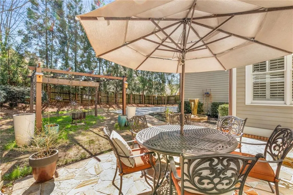 View of patio / terrace featuring outdoor dining area and fence