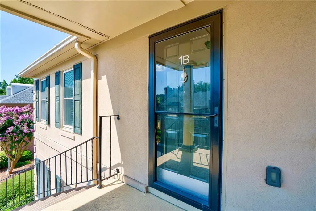 Property entrance with stucco siding