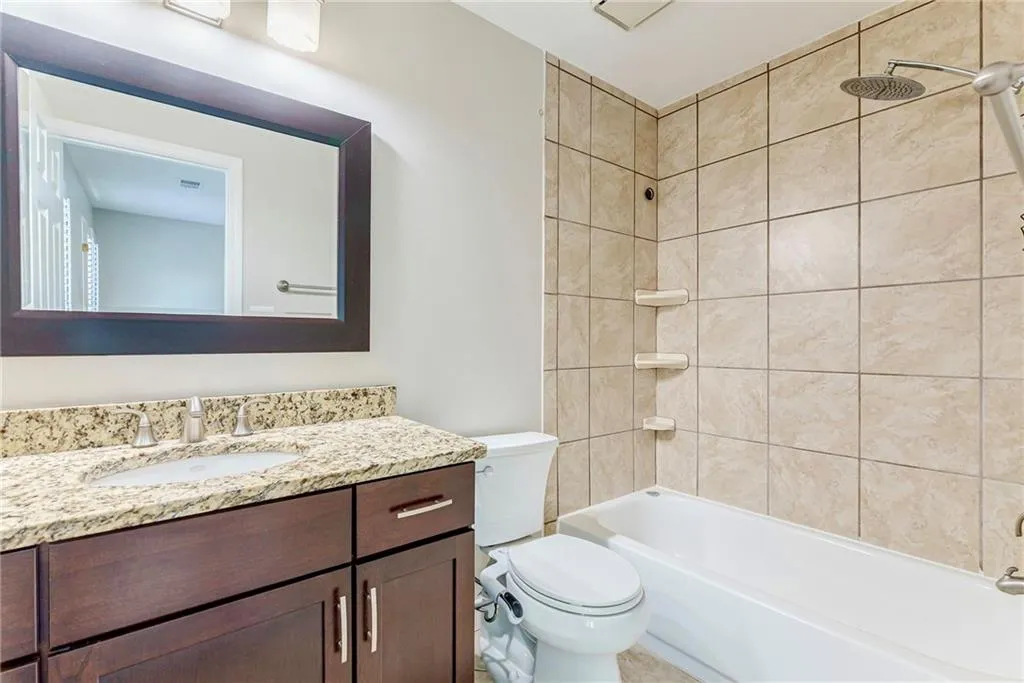 Full bath with vanity and bathing tub / shower combination