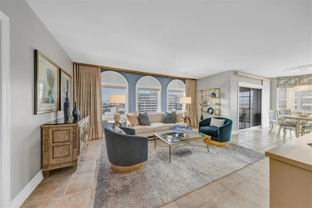Expansive living room with tailored draperies and blinds