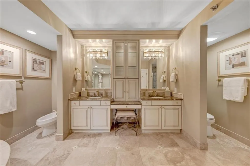 Gorgeous custom-built double vanity; also pictured, toilet on the right and bidet on the left