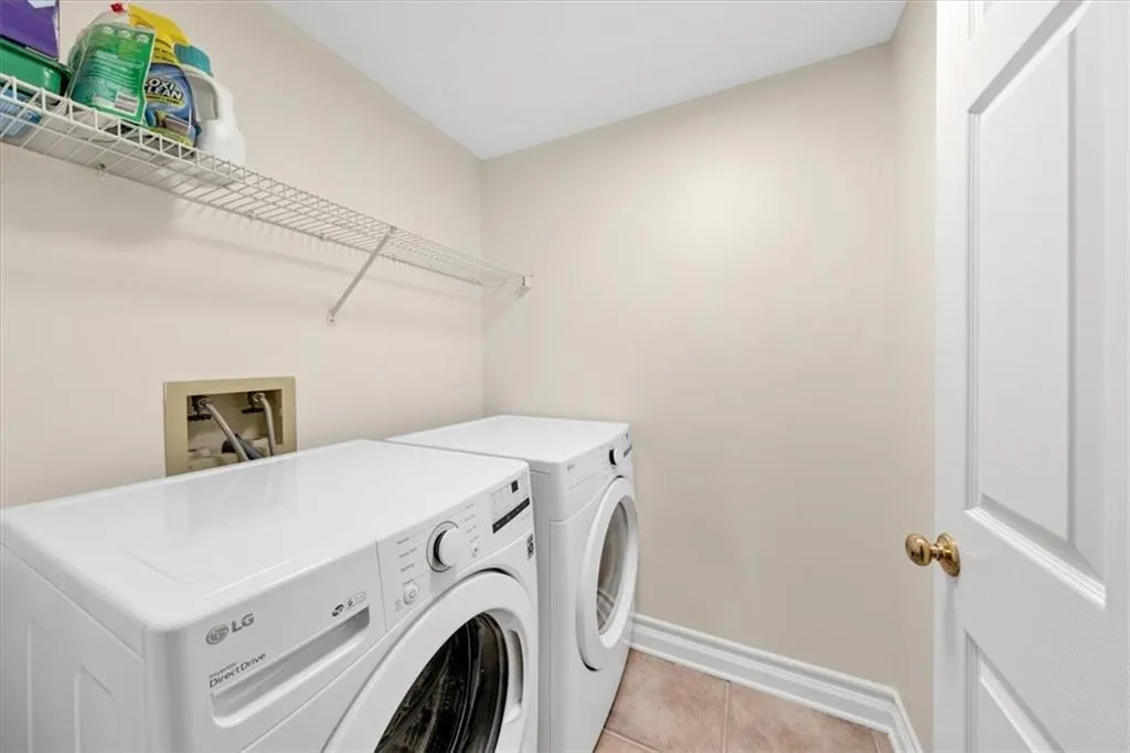 Sizeable laundry room with newer washer and dryer included