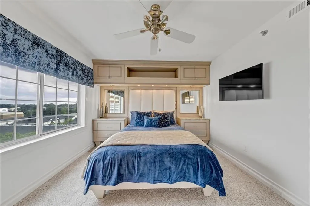 Guest bedroom with custom-built bed, headboard and built-ins