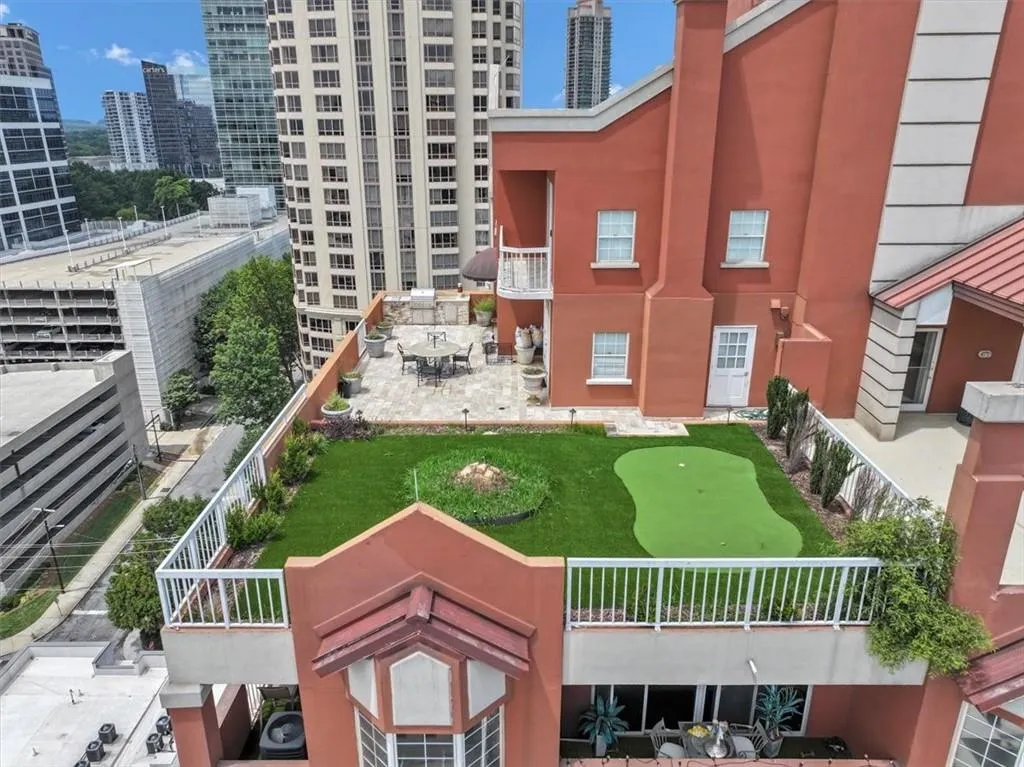 Rooftop community courtyard featuring a putting green