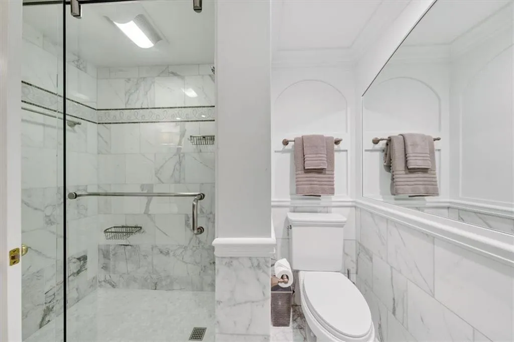 Elegant guest bathroom with newly converted shower, new plumbing, faucets and toilet