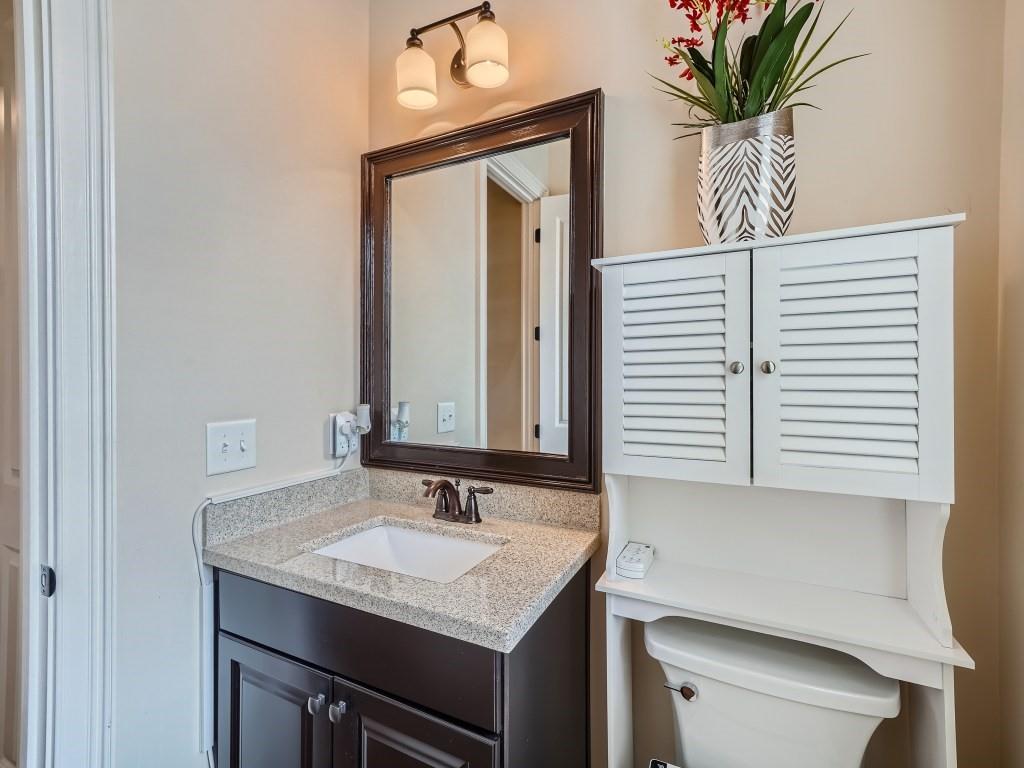 Bathroom with toilet and large vanity