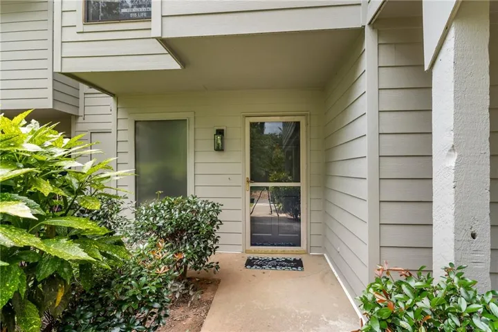 Covered entryway featuring horizontal siding and a full-light storm door
