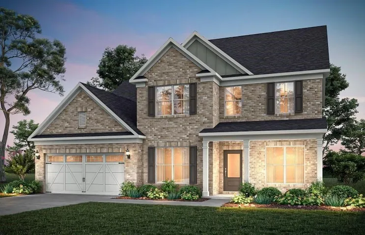 Two-story brick exterior with dark shingle roofing and white trim