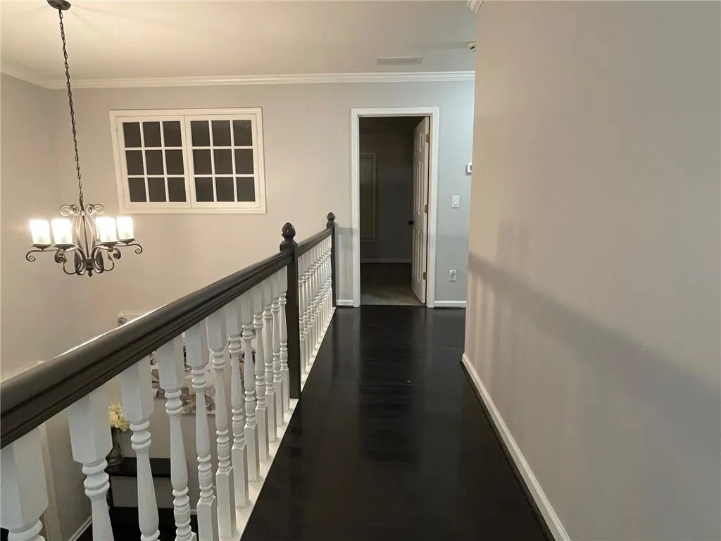 Upstairs walkway leading to bedrooms