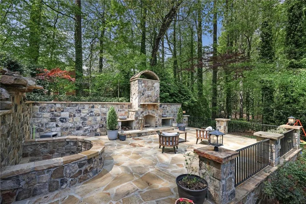 Incredible outdoor living area featuring fireplace