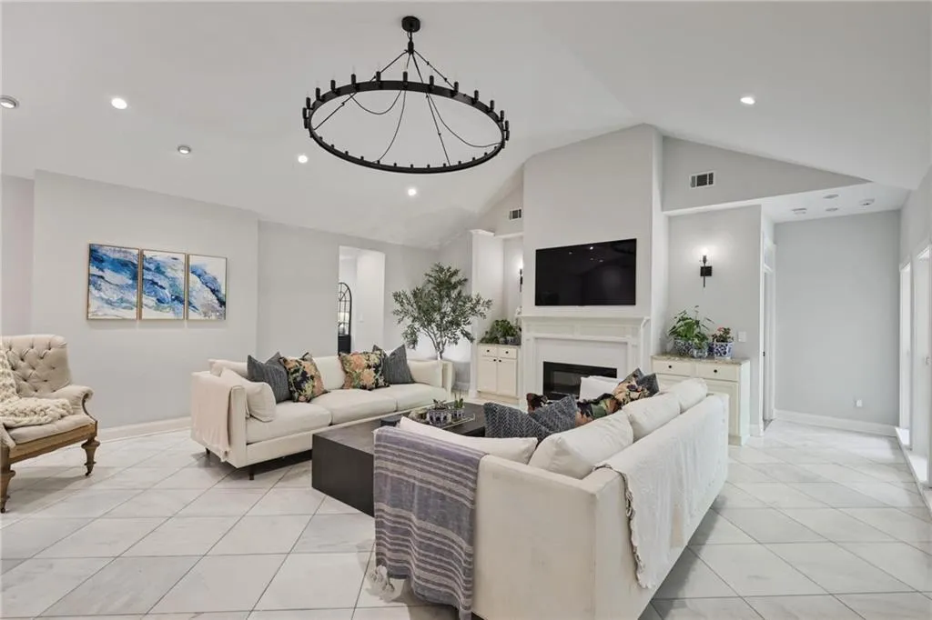 Great room features built-in cabinets and fireplace