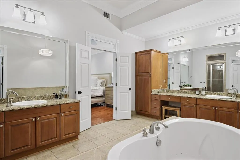 Primary bath with his and her vanities