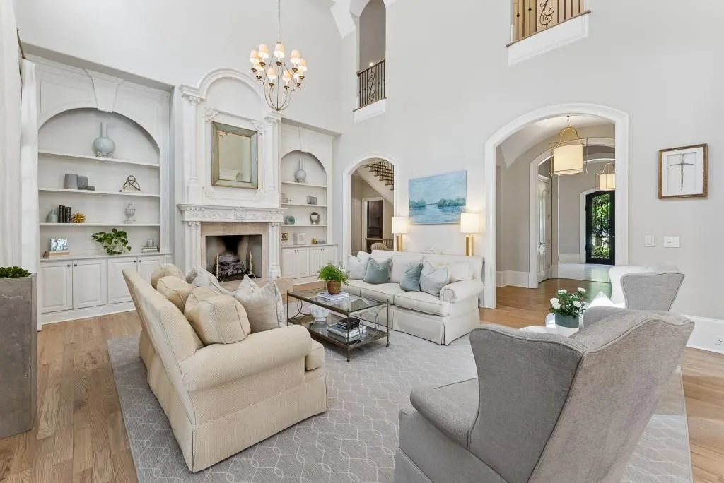 Expansive Living Room With Fireplace And Natural Light Designed For Elevated Living