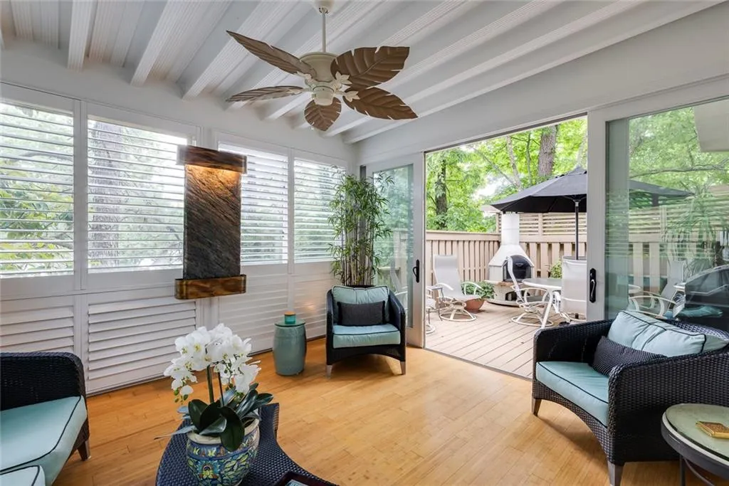 Sunroom addition with separate unit and bamboo flooring.