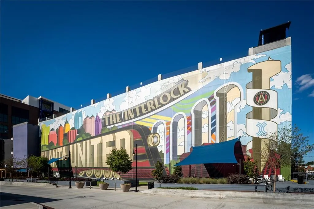 Striking mural art at The Interlock celebrates Atlanta United and the city’s vibrant culture—an iconic landmark and photo-op in the heart of West Midtown