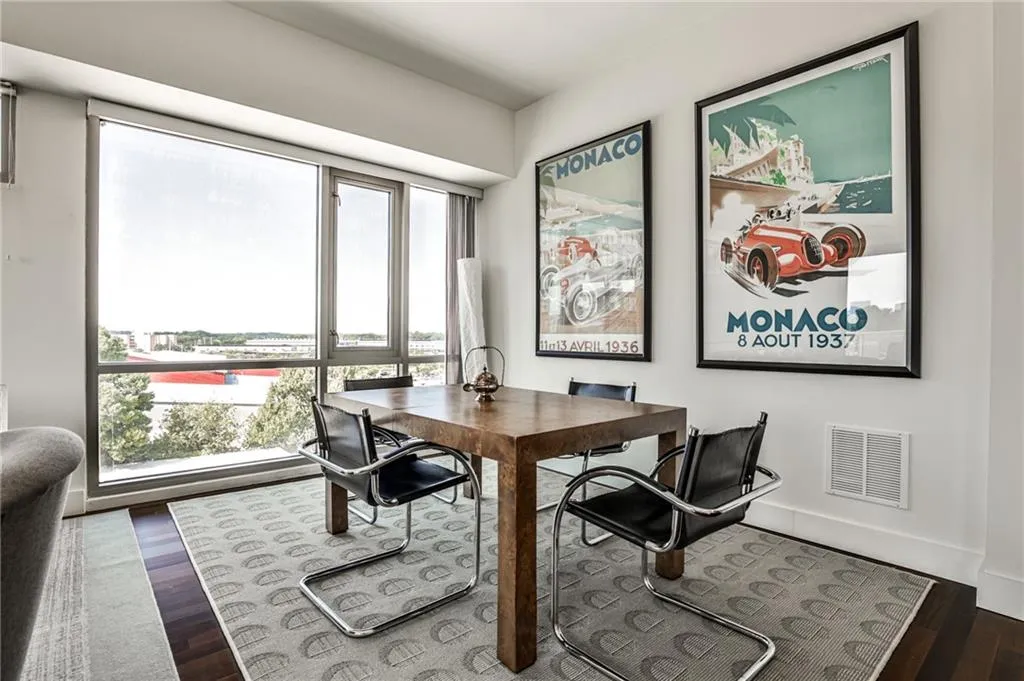 Open dining space flows effortlessly into living area with panoramic windows
