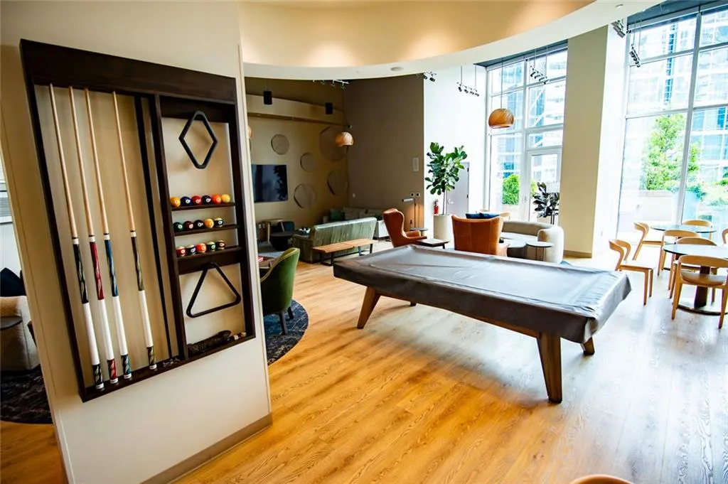 Playroom featuring billiards and wood finished floors