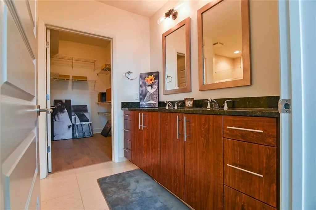 Bathroom with vanity and tile patterned flooring