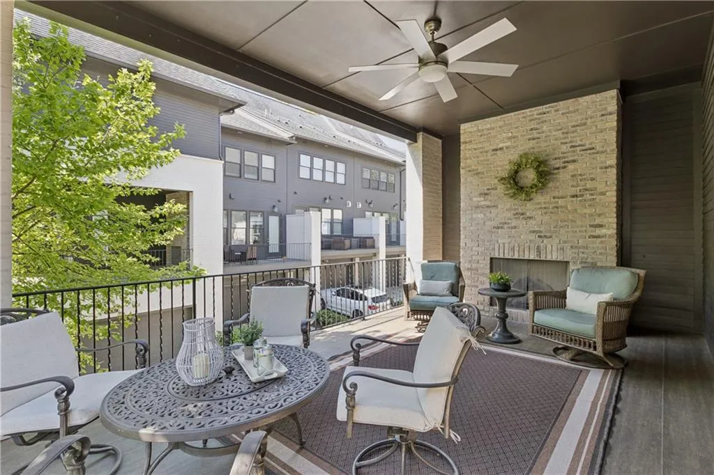 Off the kitchen through two sets of french doors is the covered porch with fireplace.