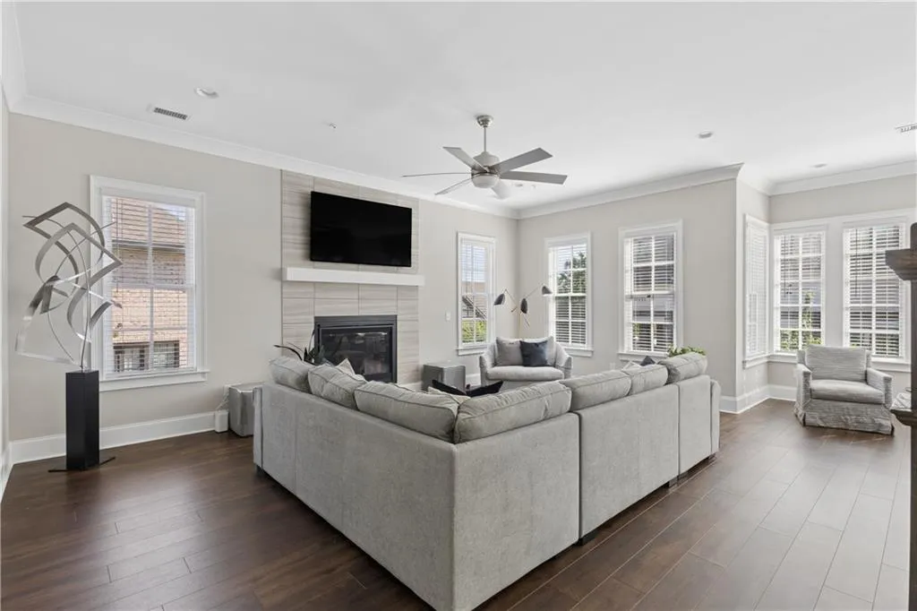 Spacious fireside great room with walls of windows and an abundance of natural light.