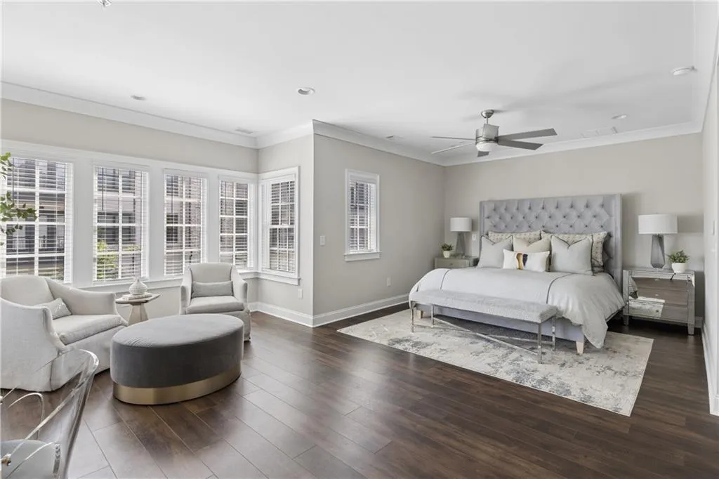 Oversized primary suite with sitting area, spa-like bath and large custom closet.