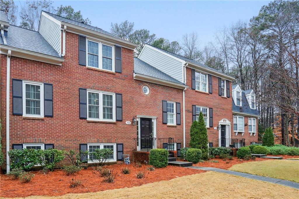 Brick front with upgraded siding and windows.