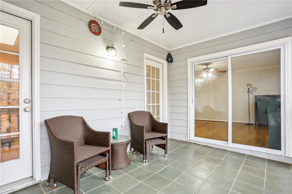 Covered rear porch with doors to great room and primary suite.