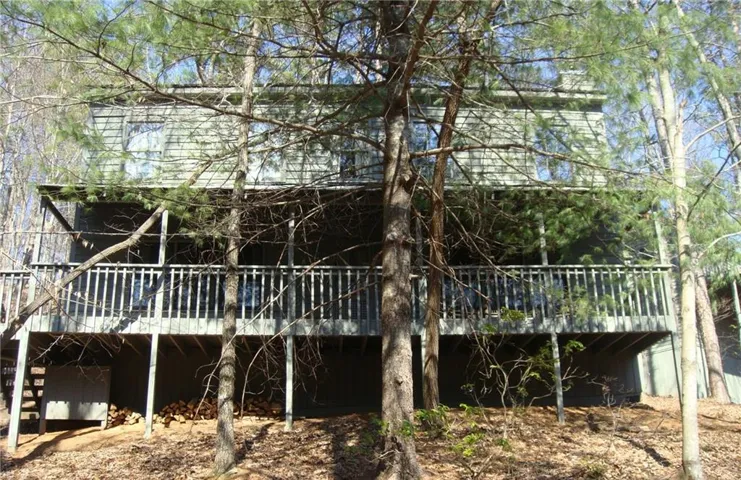 View of house featuring a deck