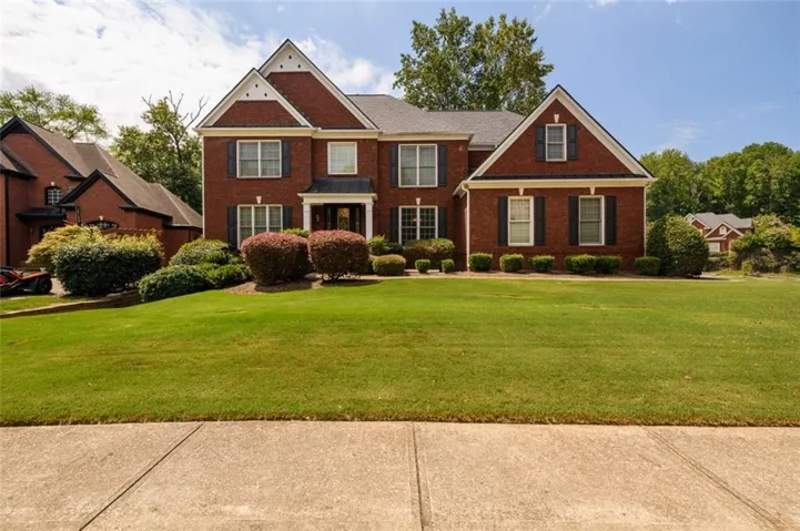 Exceptional Curb Appeal for this spacious three-sided brick home.