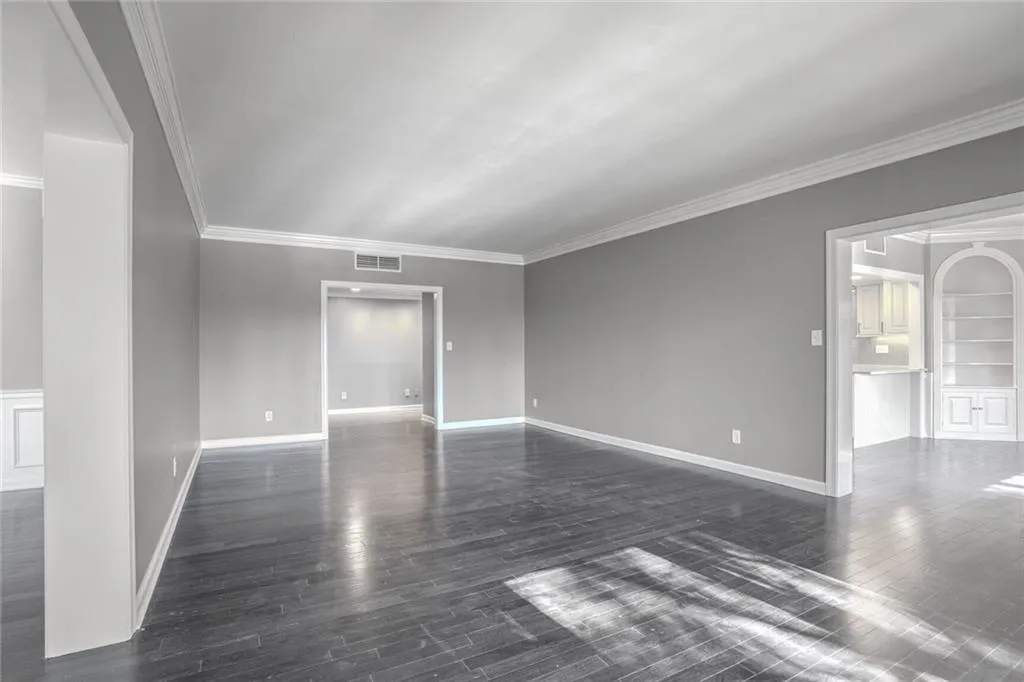 The Center of the Unit. allows you to flow easily into the dining room / kitchen or into the Den and Sunroom.