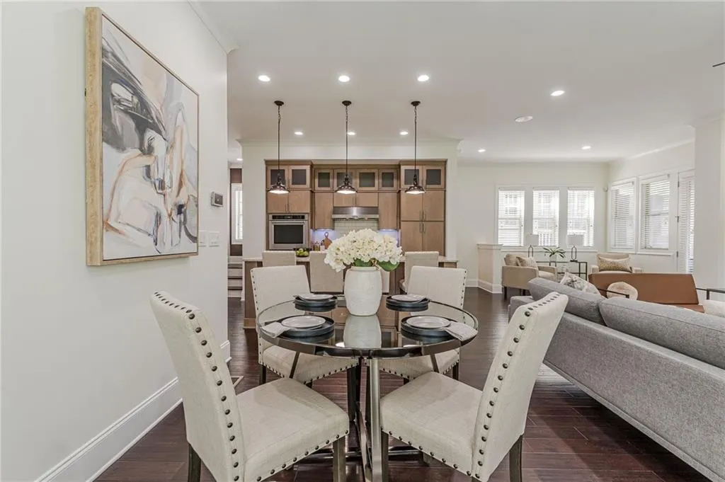 Dining space featuring crown molding and dark hardwood / wood-style floors
