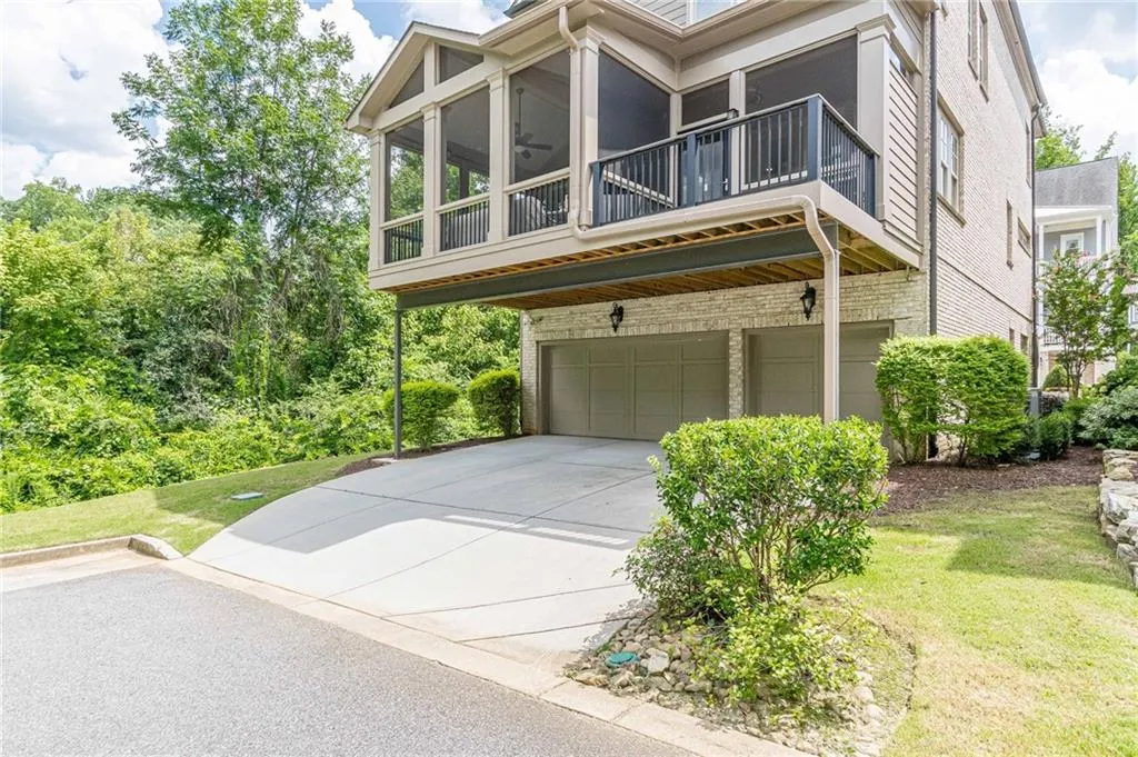 View of front of house with a garage and a front lawn